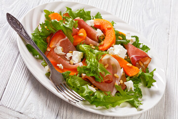 pumpkin salad with lettuce, crumbled cheese, ham