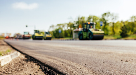 Blur background. Heavy Vibration roller at asphalt pavement working. Repairing road