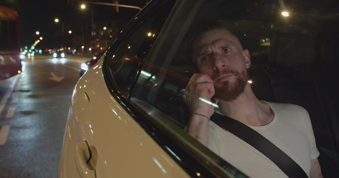 Taxi passenger Serious coversation over the phone from the back seat in the night