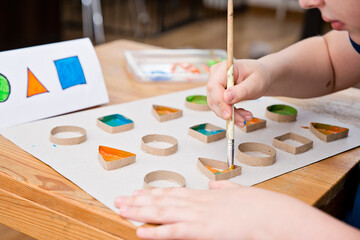 Child learn geometric shapes. Fine motor skills. Preschool or special needs tasks. Early education...