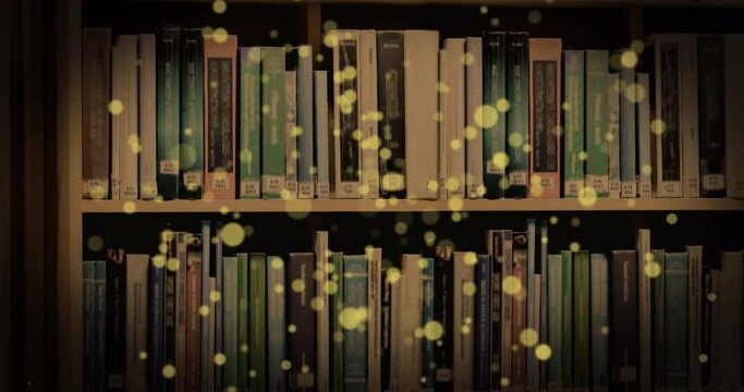 Animation of glowing spots over books on shelf