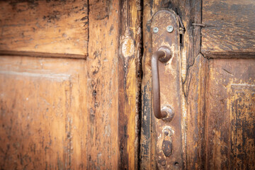 Old wooden door with a handle.