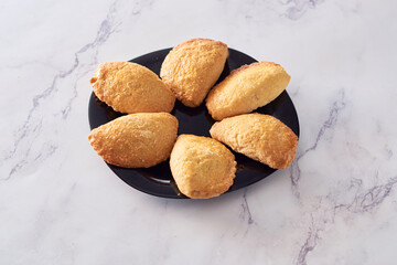 A closeup of Argentinian sweet empanadas with dulce de leche