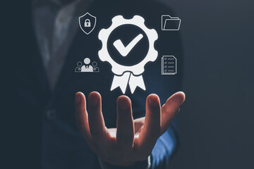Businessman Hand shows the sign of the Best quality assurance, Satisfaction guarantee, Standards, ISO certification and standardization concept.