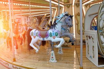 Carousel with horses at the fun fair.