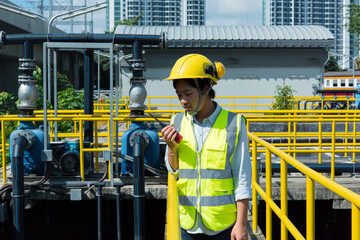 portrait of woman engineer. portrait of a engineer in waste water treatment  plant site.