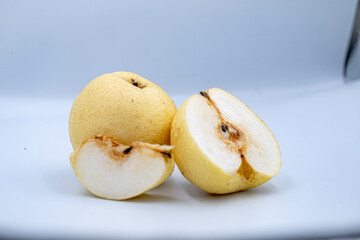 Naklejka na ściany i meble fresh Asian pear fruit on white background