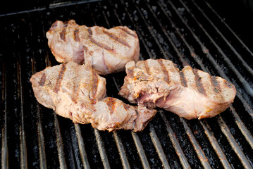 Grilling Beef Tenderloin Steaks on a Hot Summer Grill	
