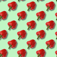 A pattern of Bulgarian red pepper on a light green background.