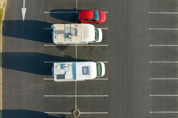 Aerial view of camper vans parked on parking lot