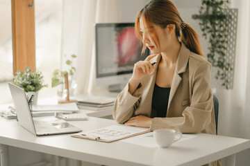 Businessmen are calculating income expenditure and analyzing real estate investment data, Accounting Financial and tax systems concept