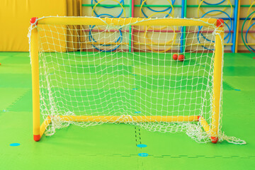 A small soccer goal in the kindergarten gym. Close up