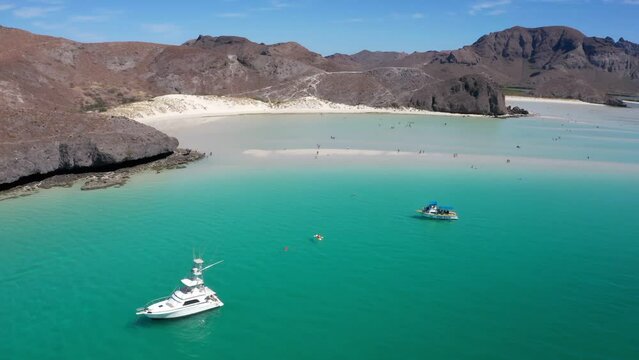 Dreamy Mexican paradise beach with white sand and blue water. popular tourist destination Playa Balandra in Mexico La Paz. thriving nature of Balandra Bay aerial video from above