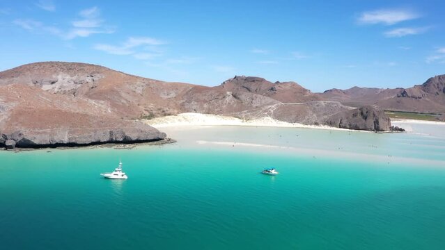 Mexican paradise beach Playa Balandra ner La Paz with white sand and blue water. popular tourist destination. Aerial video footage panoramic view from above 