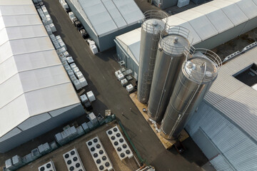 Aerial view of modern factory structure for production and distribution of industrial equipment. Concept of global industry