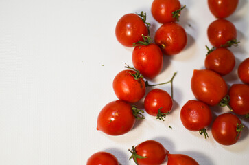 Small tomatoes on a white background, cherry tomatoes, healthy lifestyle concept