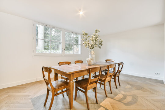 Dining Room Interior With Classy Wooden Table And Chairs