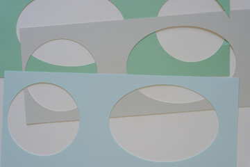 green, gray, and blue paper stencils with shapes 