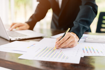 Businessmen are Home Working, Watching something on computer laptop, He was thinking about something and thinking of analyzing the graph, Business graph analysis concept.