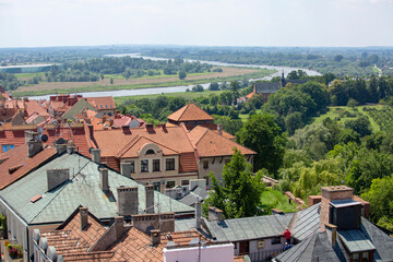 Fototapeta na wymiar Sandomierz, Poland - July 10, 2020: Aerial view of the old town houses and the bend of the Vistula River
