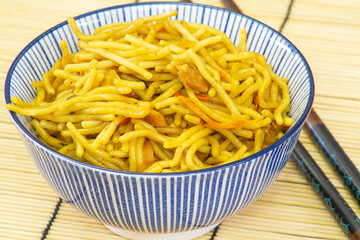 bowl of spaghetti with chilli sauce