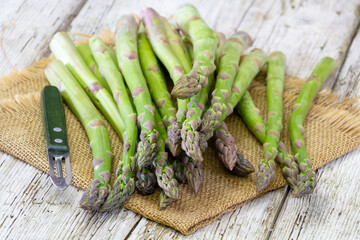 fresh green asparagus on wooden background