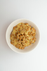 Delicious looking natto in a bowl on a white background