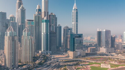 Skyscrapers of Dubai Marina near intersection on Sheikh Zayed Road with highest residential buildings timelapse