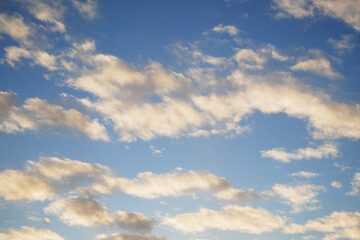 Obraz premium White, fluffy clouds in blue sky. Background from clouds. Beauty clear cloudy in sunshine.