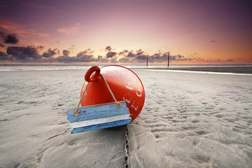Poster Im Rahmen red buoy on the beach © Jenny Sturm