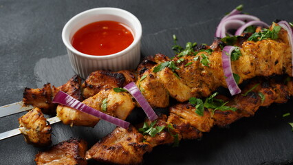 Barbecue meat. Chicken kebab. Chicken Shashlik with vegetables on wooden background. Rustic style. Top view