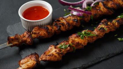 Barbecue meat. Chicken kebab. Chicken Shashlik with vegetables on wooden background. Rustic style. Top view