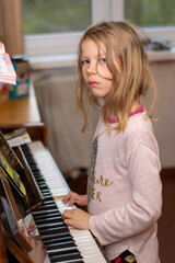 little girl at the piano