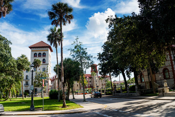 Palm trees and blue sky over the buildings in the Spanish style of the city of St. Augustine.