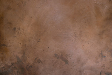 Grunge copper background with blurred effect. Copy space. 