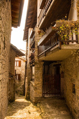 Fototapeta na wymiar A residential street in Poffabro, an historic medieval village in the Val Colvera valley in Pordenone province, Friuli-Venezia Giulia, north east Italy 