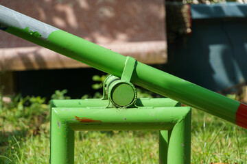 Closeup of green seesaw