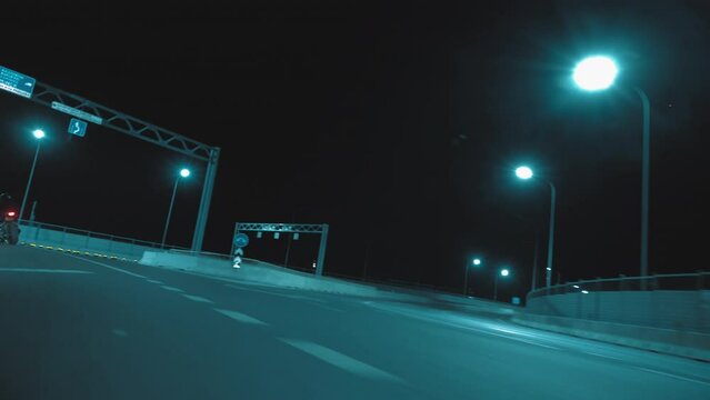 A man enters a turn on a sports motorcycle and picks up speed