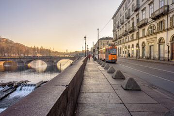 Turin, Italy. February, 15, 2022. View at sunset on the Po river In the distance the ancient...