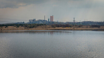 Fototapeta premium Lake in Karvina city known locally as Karvinske more with a view on mining tower, the lake was created when the mined ground fell below the level of the groundwater