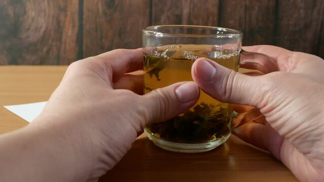 Tea with marijuana, cannabis with herbal decoction to treat pain and increase appetite. Hemp herbal tea, concept of marijuana use for medicinal purposes.