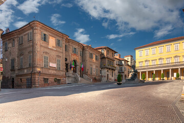 Bra; Cuneo; Piedmont; Italy - May 01; 2022: Town hall building of Bra (project by Bernardo Vittone 1897) in piazza Caduti per Liberta with ancient medieval buildings in the background