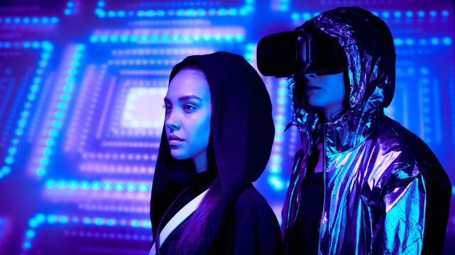 Side view of young people as characters of virtual space standing against digital background