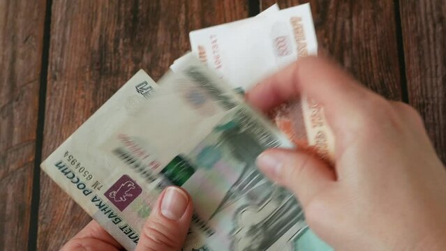hand couning Paper banknotes Russian Rubles. Russian money rubles face. Closeup of Russian rubles. The concept of Finance and economy