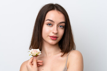 Young Ukrainian woman isolated on white background holding flowers. Close up portrait