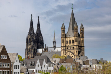 Fototapeta na wymiar Two medieval church towers rising above Cologne skyline
