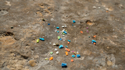 Macro shot of microplastic particles. Plastic pollution and water pollution concept.