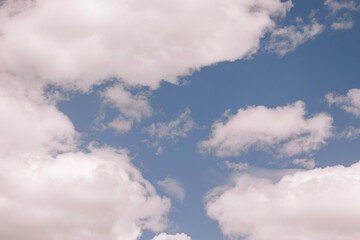 Fluffy clouds on the blue sky
