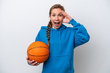 Young caucasian woman playing basketball isolated on white background with surprise expression