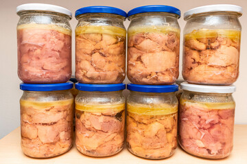 There are jars of chicken stew on the shelf. Home-made eco-friendly products